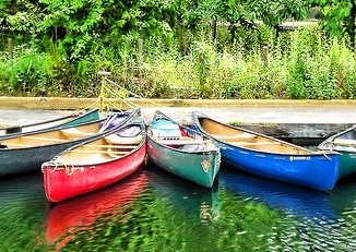 Image by Steven Iodice from Pixabay of canoes