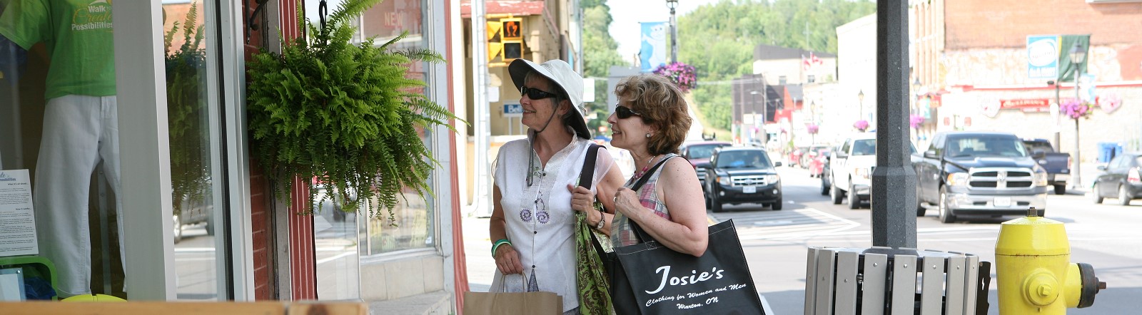 Two women walking in downtown Wiarton BIA area