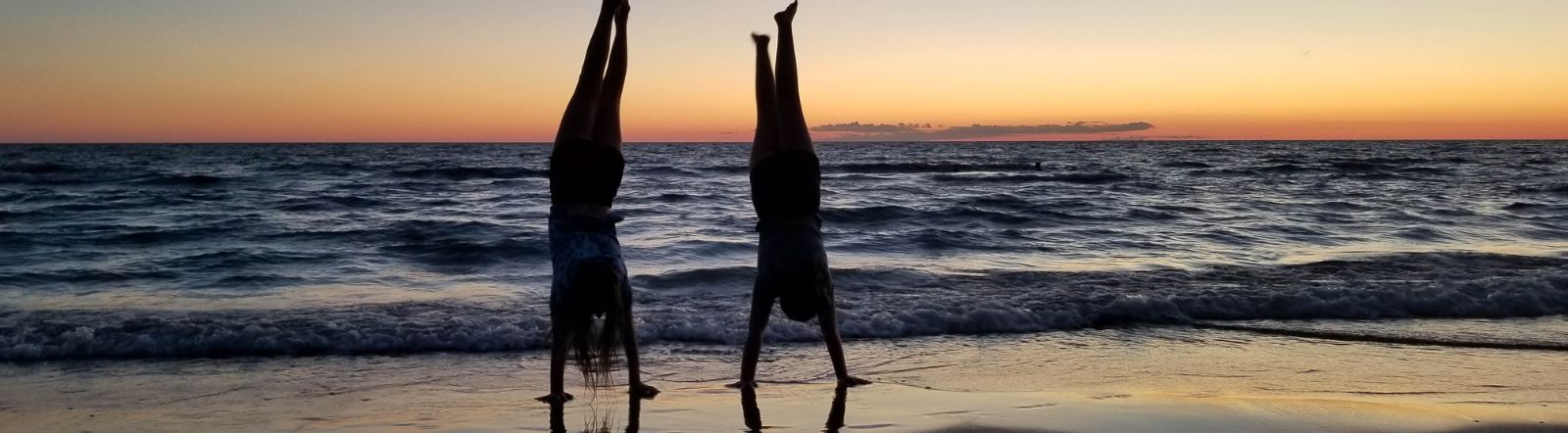 Photo of kids doing a handstand