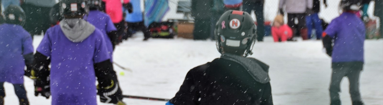 Photo of children playing hockey