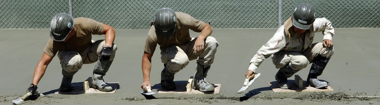 Image by 272447 from Pixabay of three cement workers